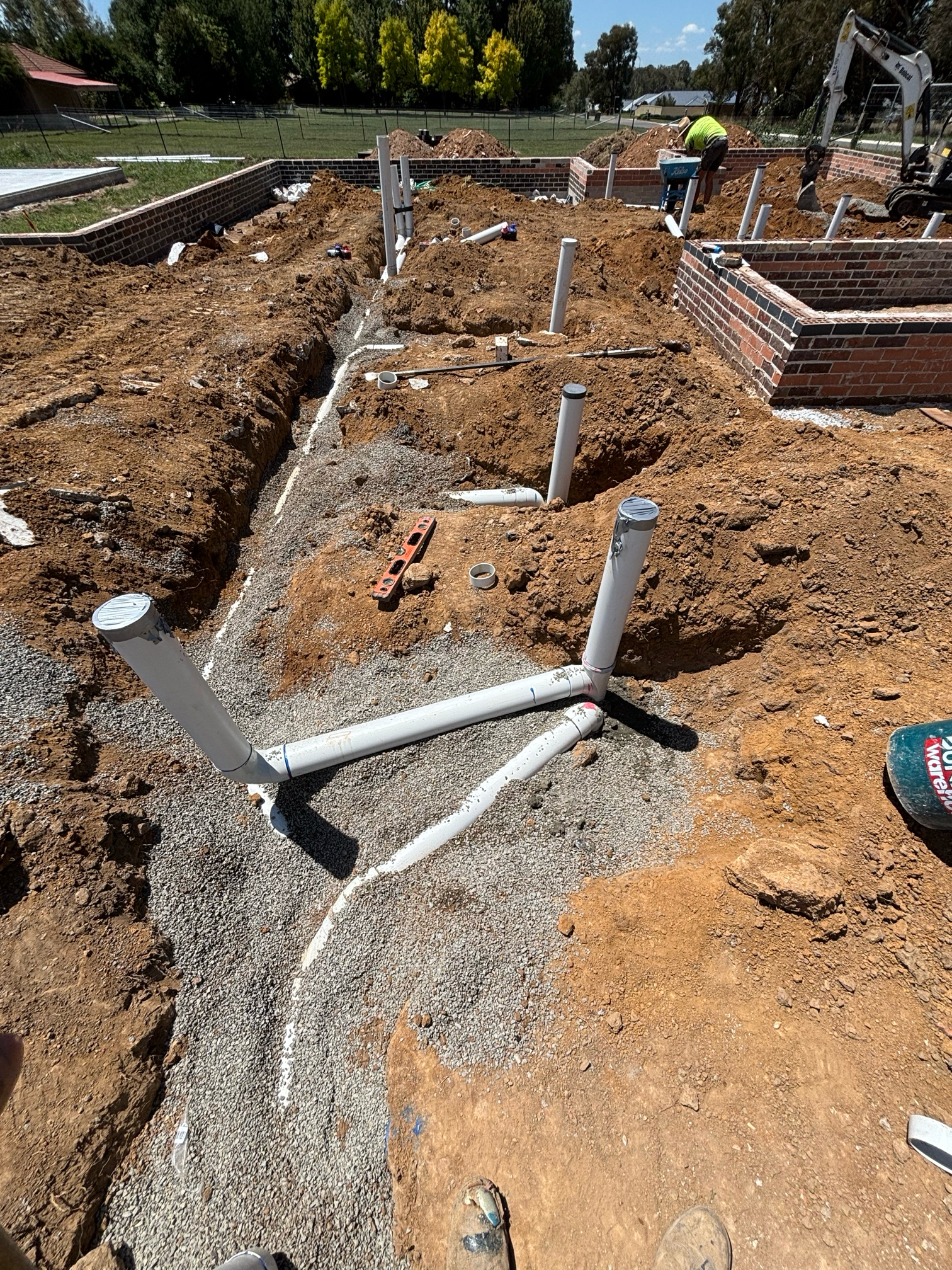 Construction Site With Plumbing Pipes in Trenches — Croker Plumbing and Gas in Goulburn, NSW