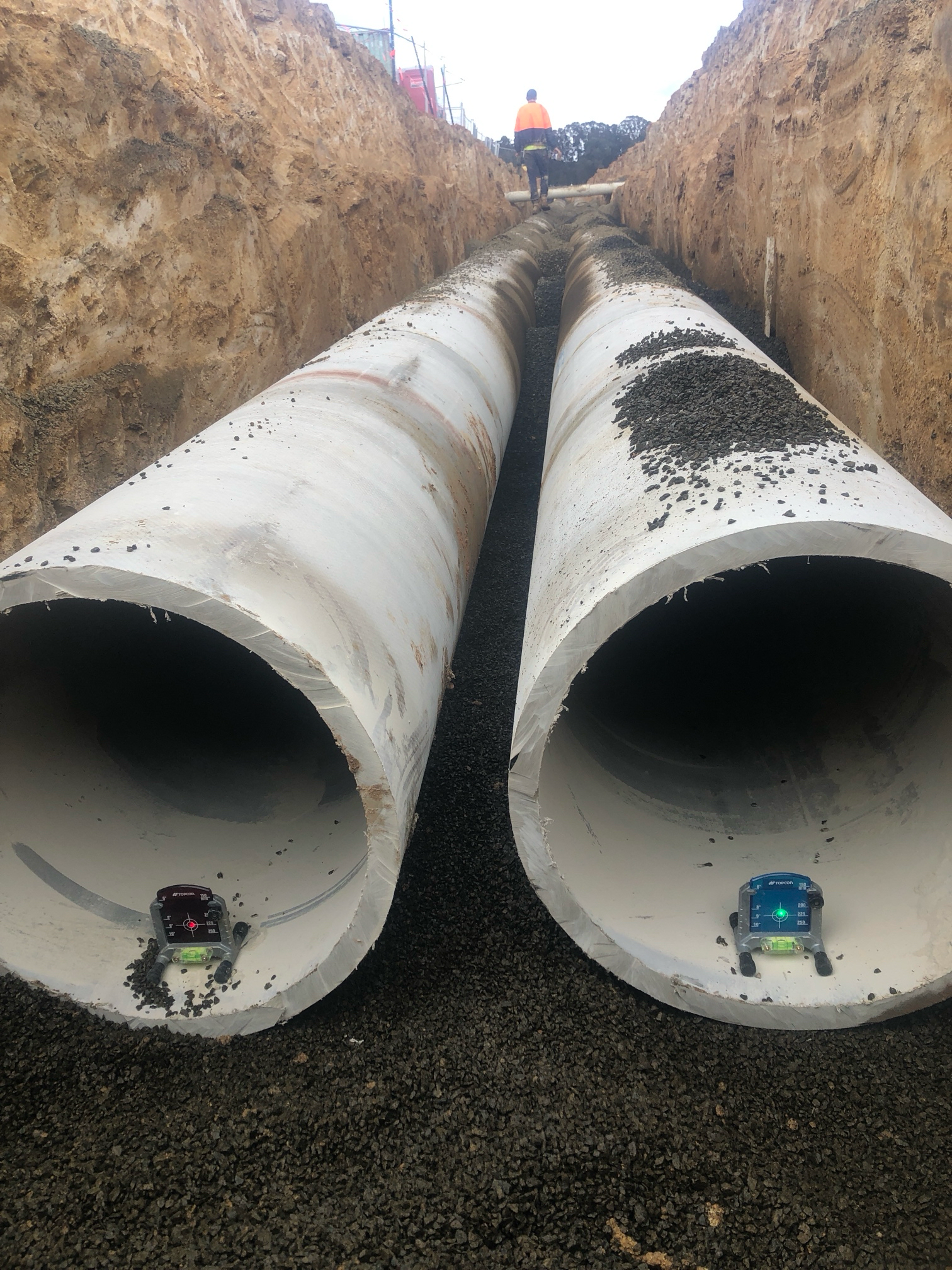 Two Large Concrete Pipes in a Trench, Gravel Base — Croker Plumbing and Gas in Goulburn, NSW