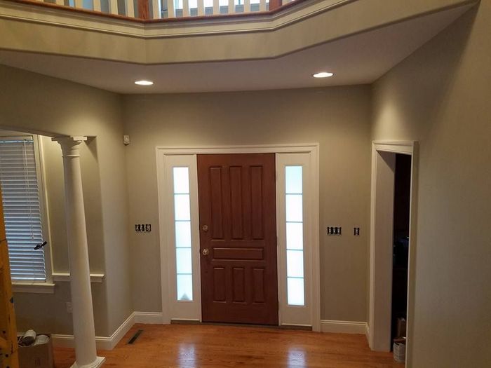 A hallway with a red door by EK Painting local painter for central PA