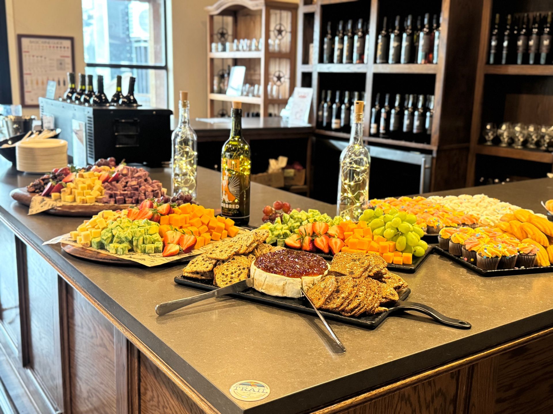 Charcuterie board with fruit, cheese, and crackers at a wine bar.