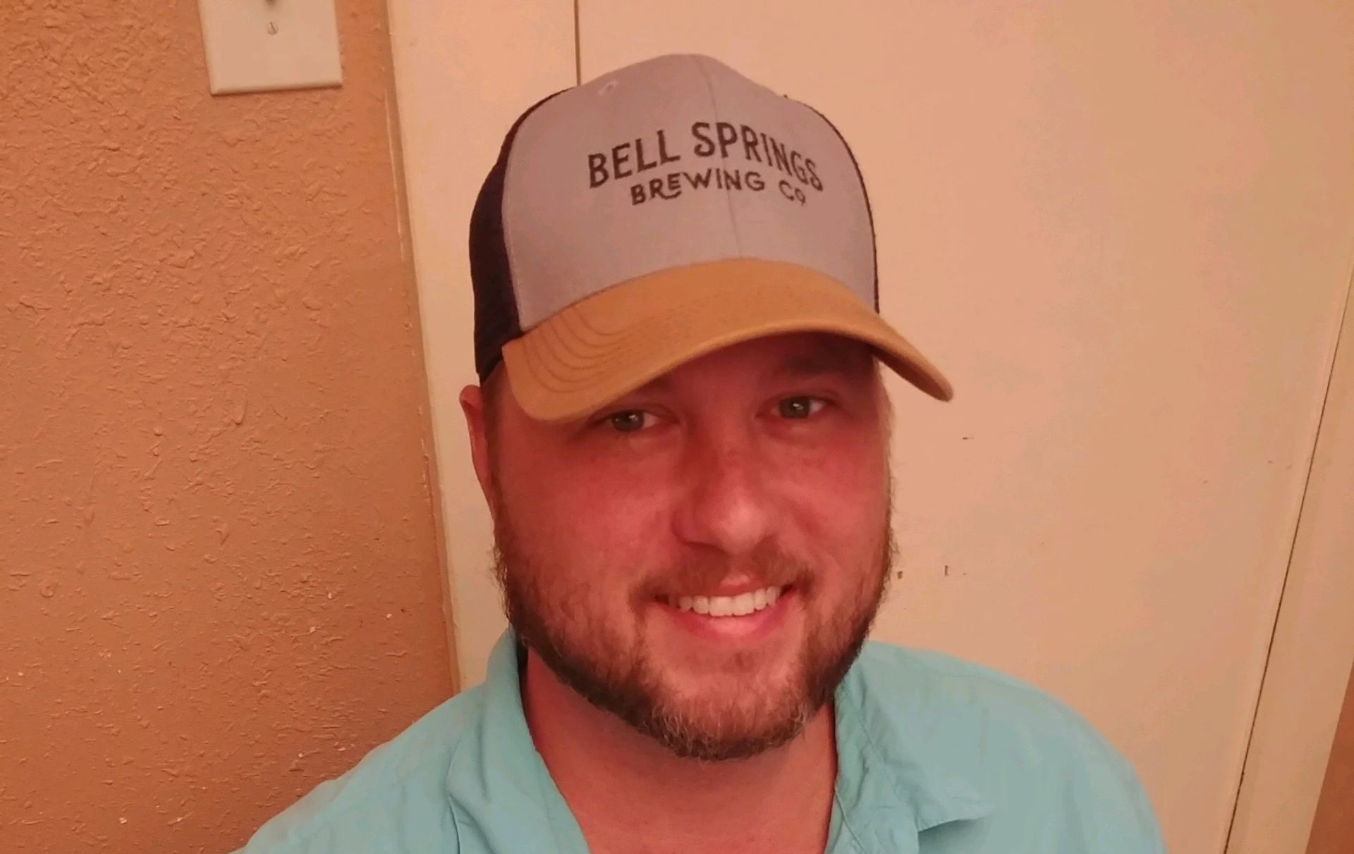 Man in a grey and tan 