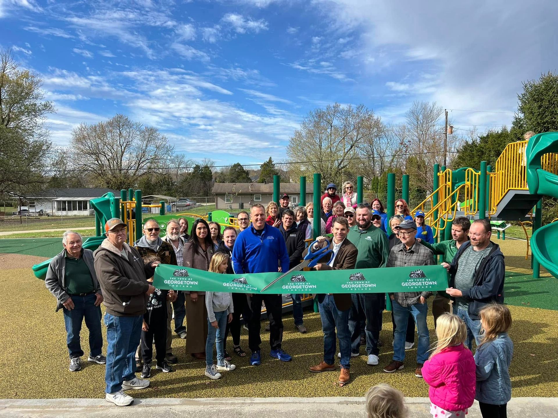 Mike Davenport standing at the ribbon-cutting ceremony with Town Council President Chris Loop, 