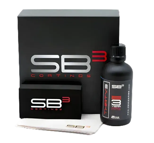 a bottle of sb3 coatings sits next to a box