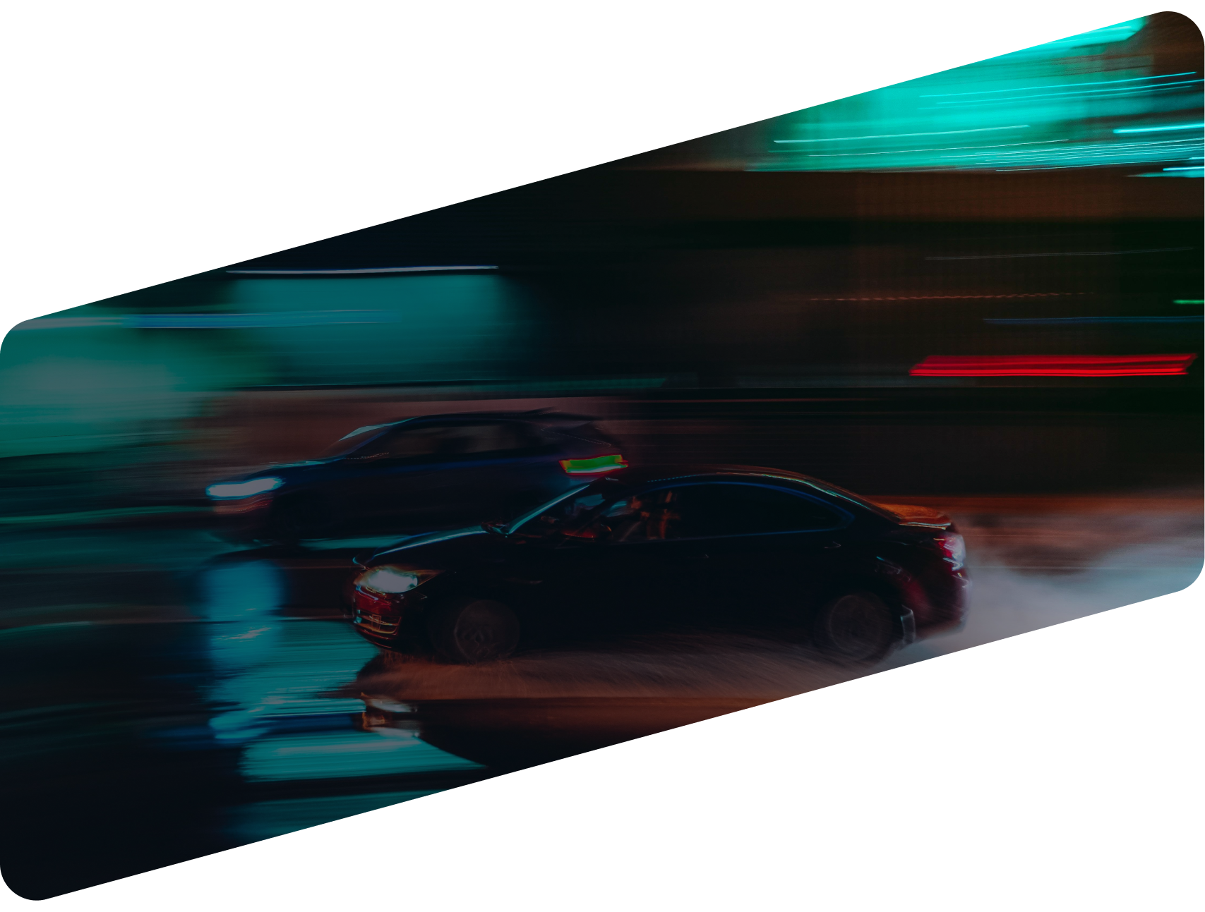Two cars driving on a road at night, captured with motion blur against a city background with teal and dark tones | Ames Automotive STC