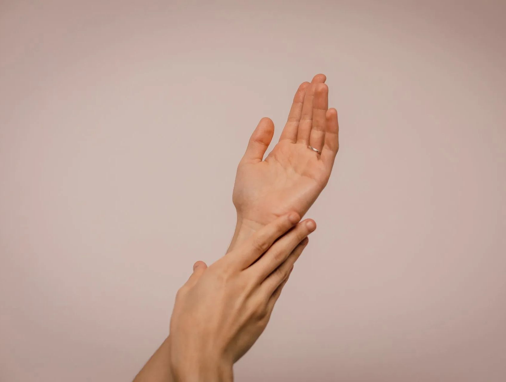 Woman Massaging Hands
