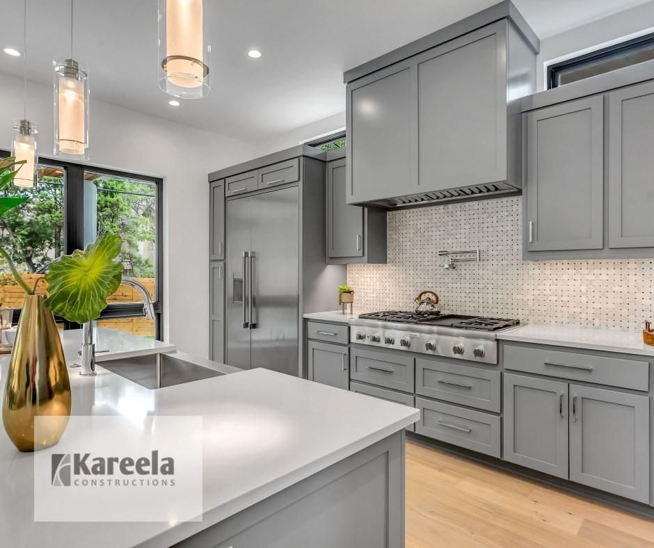 A Bathroom With a Sink, Mirror and Towel Hanging on the Wall — Kareela Constructions In Tamworth, NSW
