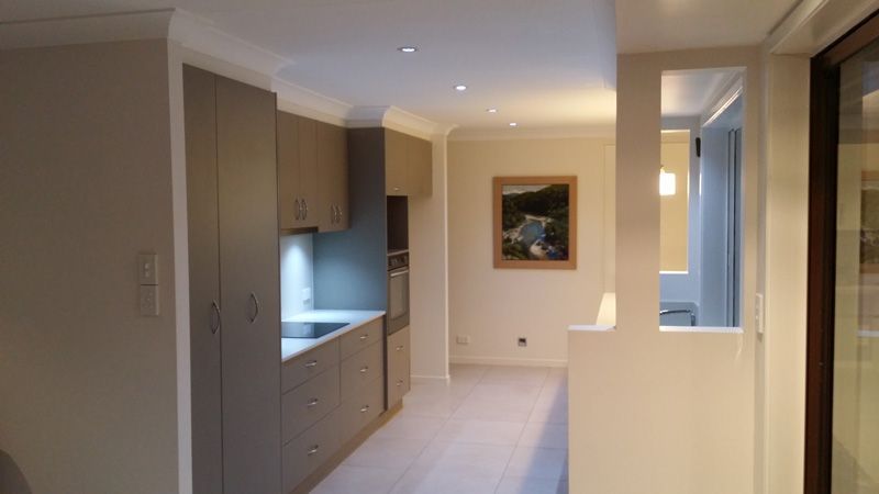 Kitchen with grey cabinets — Home Builders in Tamworth, NSW