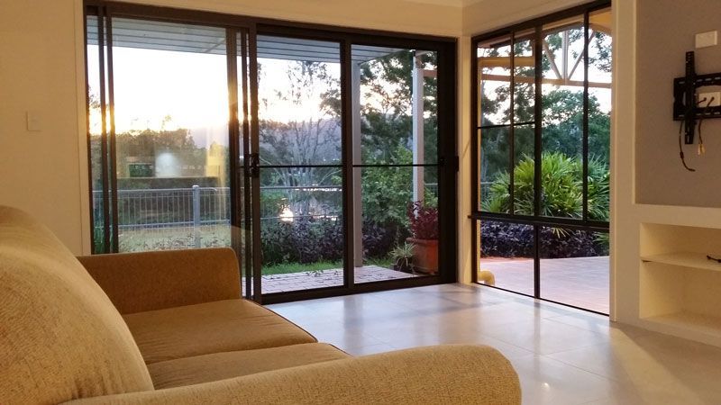Living room with sliding doors — Home Builders in Tamworth, NSW