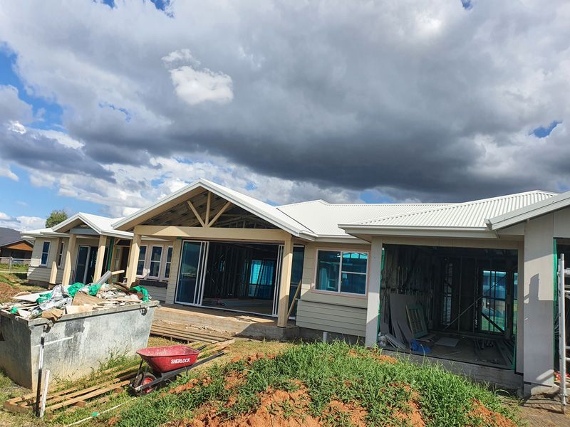 House under construction while sky looks heavy clouded — Home Builders in Narrabri, NSW