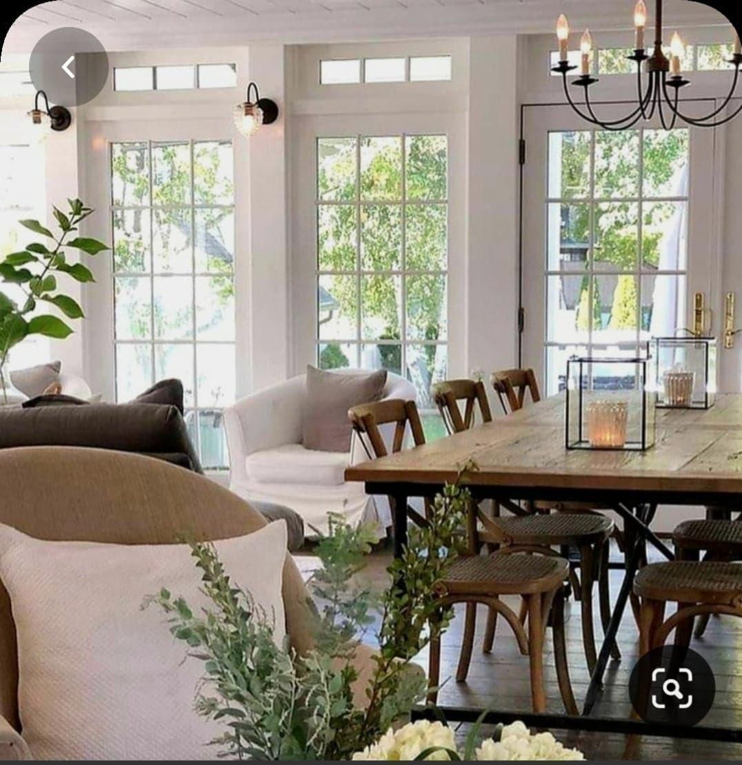 A Living Room With a Table and Chairs and a Chandelier — Kareela Constructions In Tamworth, NSW