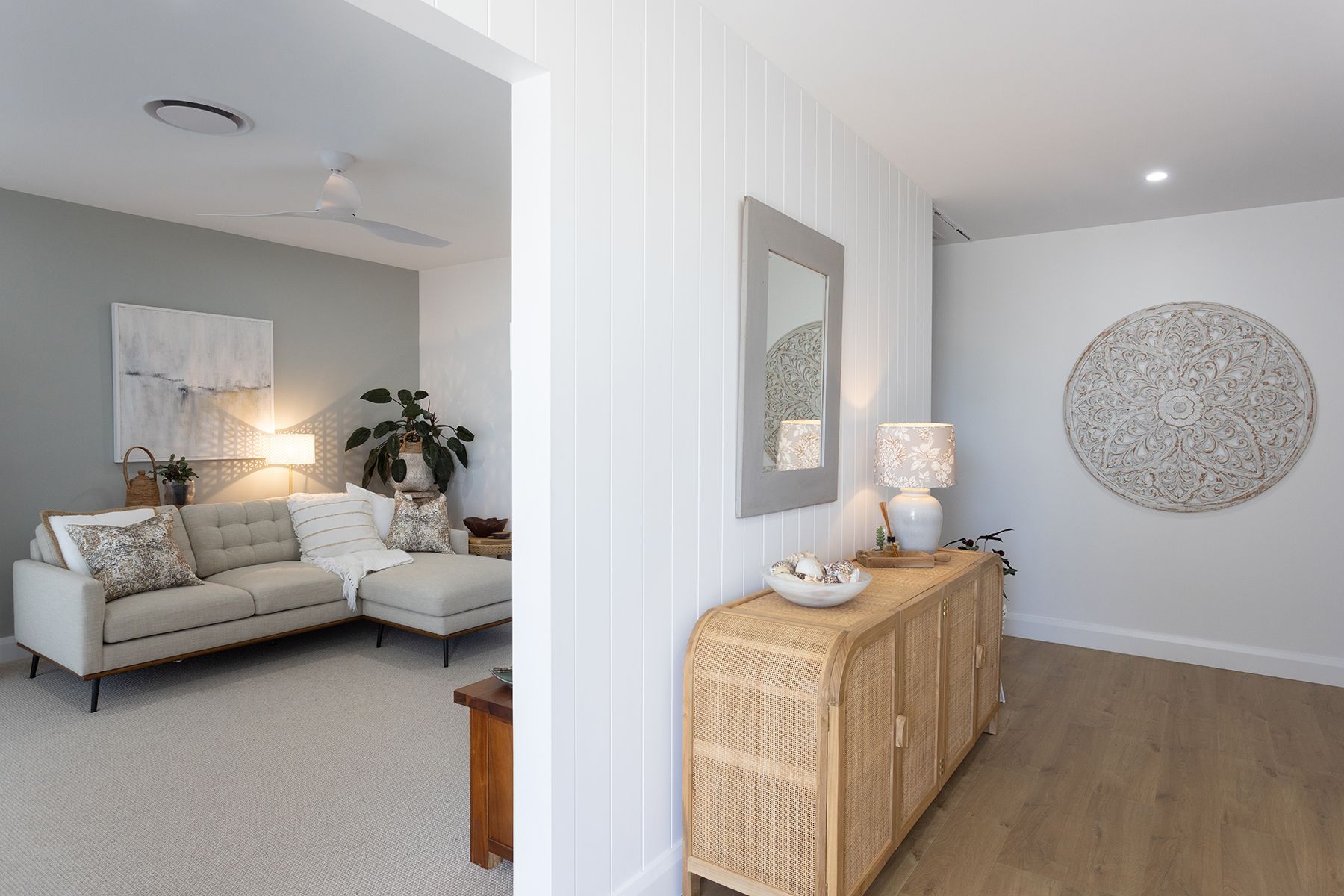 Hallway table with entry to grey lounge in living room  — Kareela Constructions In Tamworth, NSW