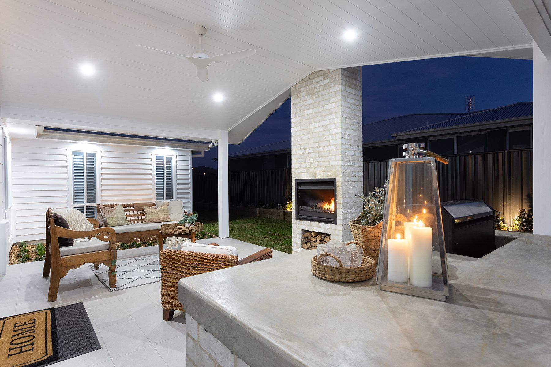 House Outdoor Area With Candles And Fireplace During the Night — Kareela Constructions In Tamworth, NSW