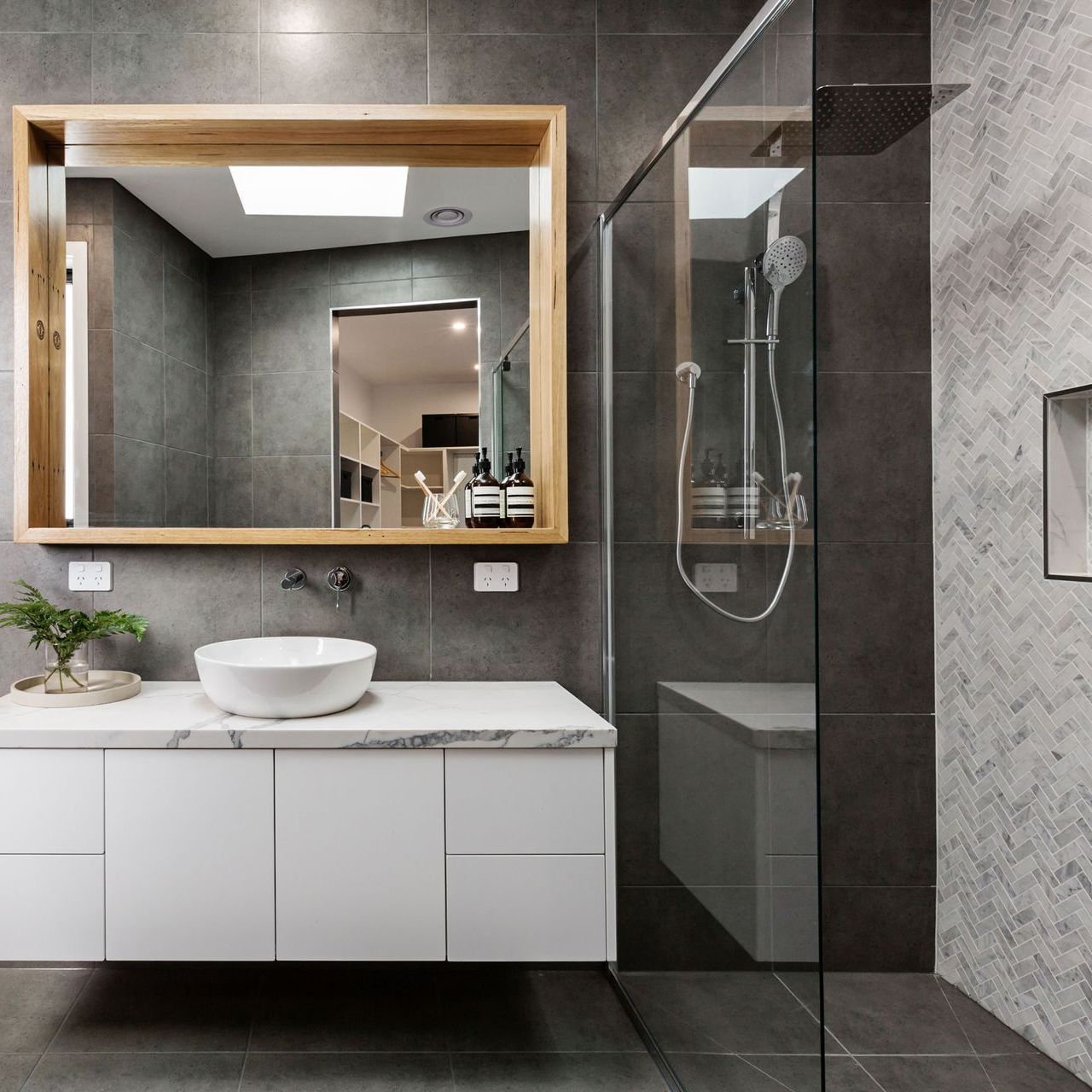 Modern Grey Designer Bathroom With Herringbone Shower Tiling