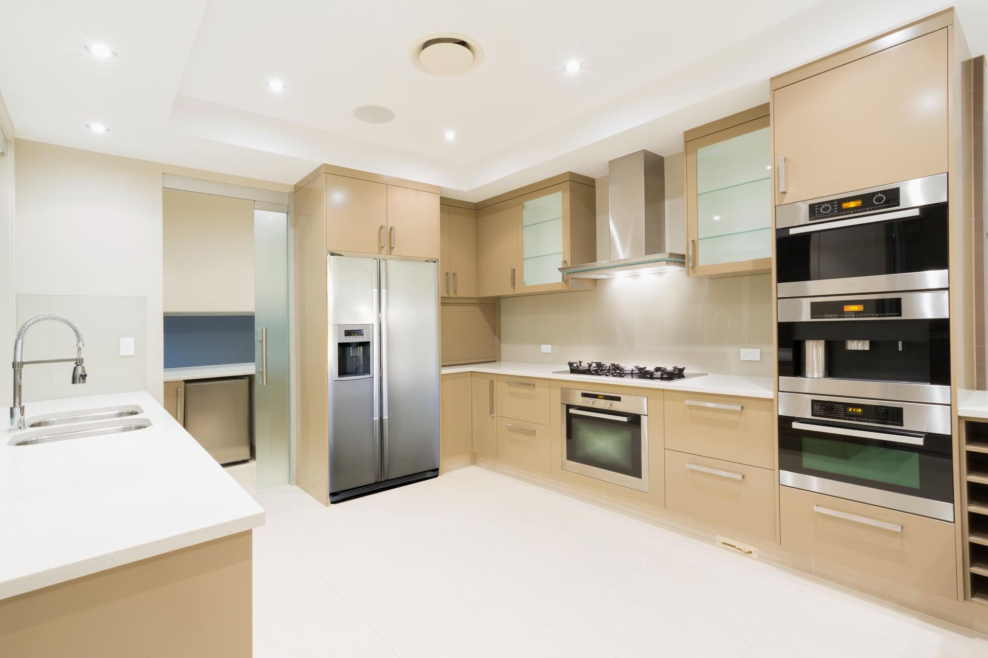 A Kitchen With Wooden Cabinets — Kareela Constructions In Tamworth, NSW