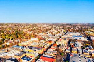 An Aerial View of a City With Lots of Buildings and Trees — Kareela Constructions In Armidale, NSW