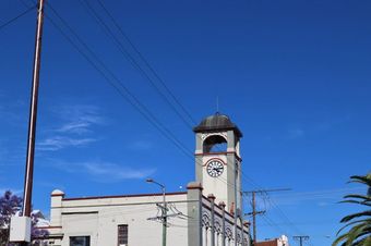 A Clock Tower With a Blue Sky in the Background — Kareela Constructions In Gunnedah, NSW