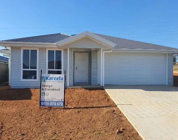 A House With a Sign in Front of It — Kareela Constructions In Tamworth, NSW