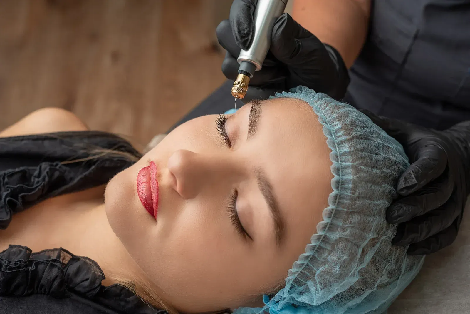 A woman is getting a facial treatment at a beauty salon.