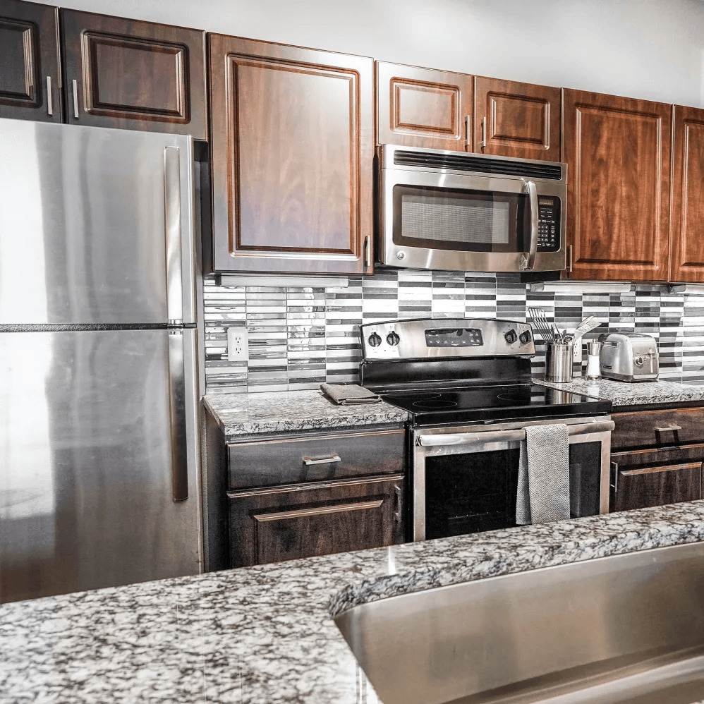 Kitchen with stainless steel appliances |  Beck at Wells Branch