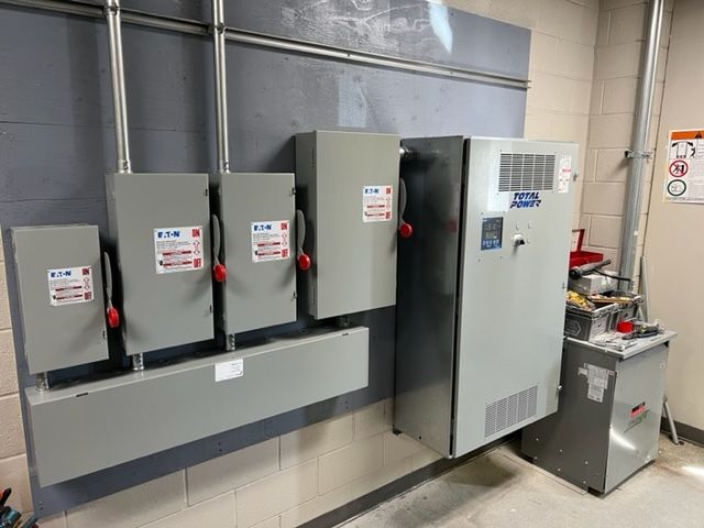 Commercial Electrical Contractor - A large electrical box with a warning sign on it