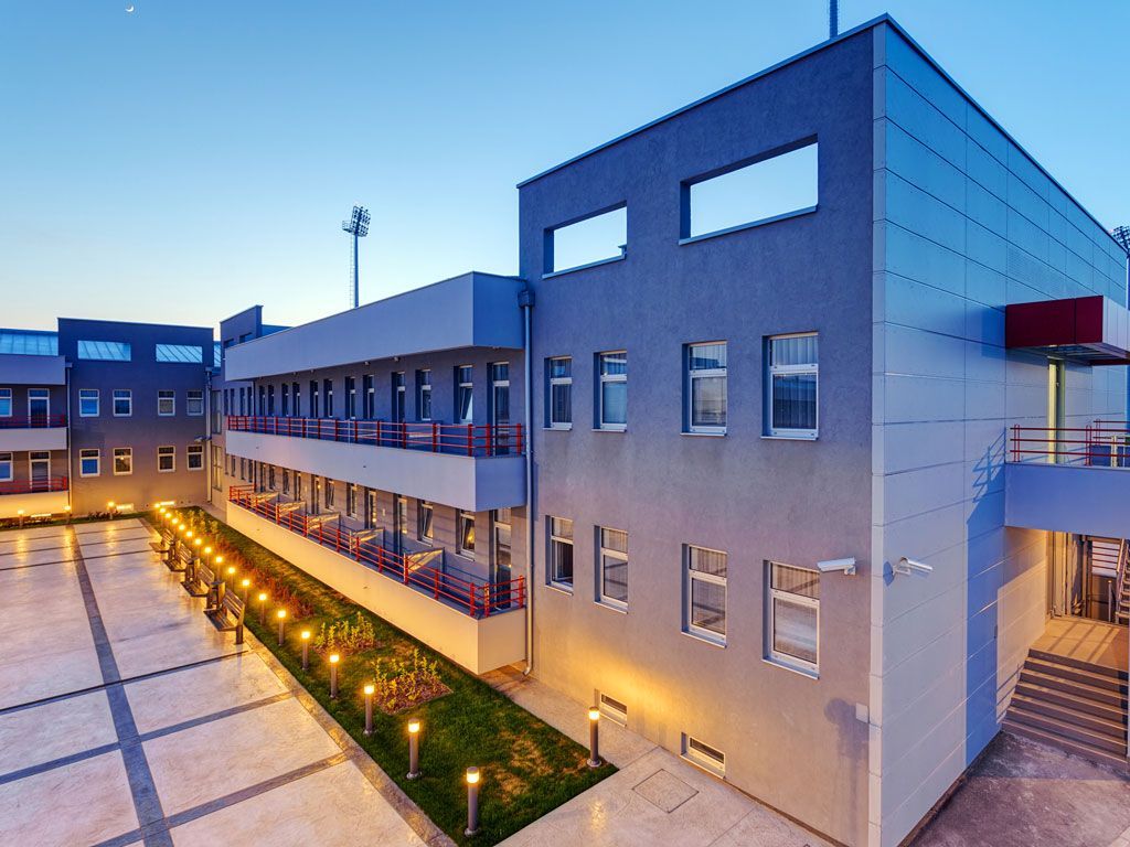 A large building with a lot of windows and balconies