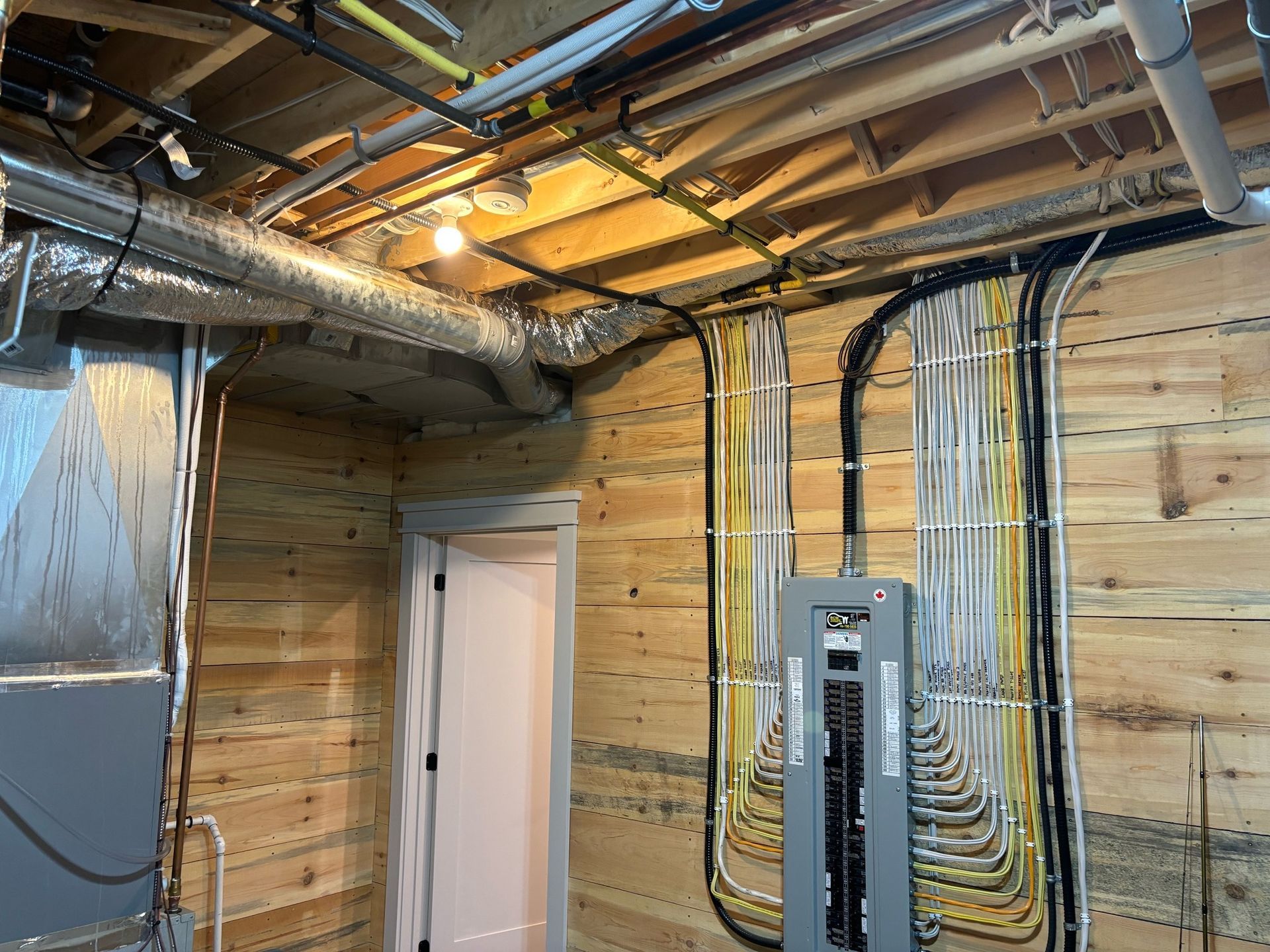 Residential Electrical Contractor - A box with wires coming out of it is on a brick wall.