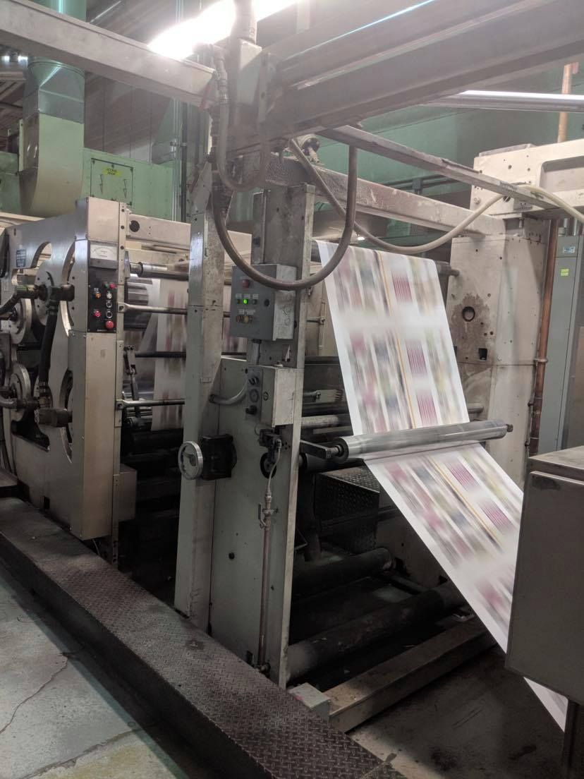 Industrial Electrical Contractor - A machine is printing a piece of paper in a factory.