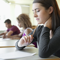 A student struggling with her language paper