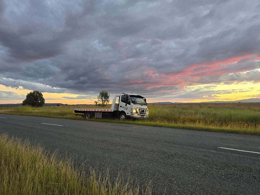 A Tow Truck is Parked on the Side of the Road in a Field — Tow Biz in Park Avenue, QLD