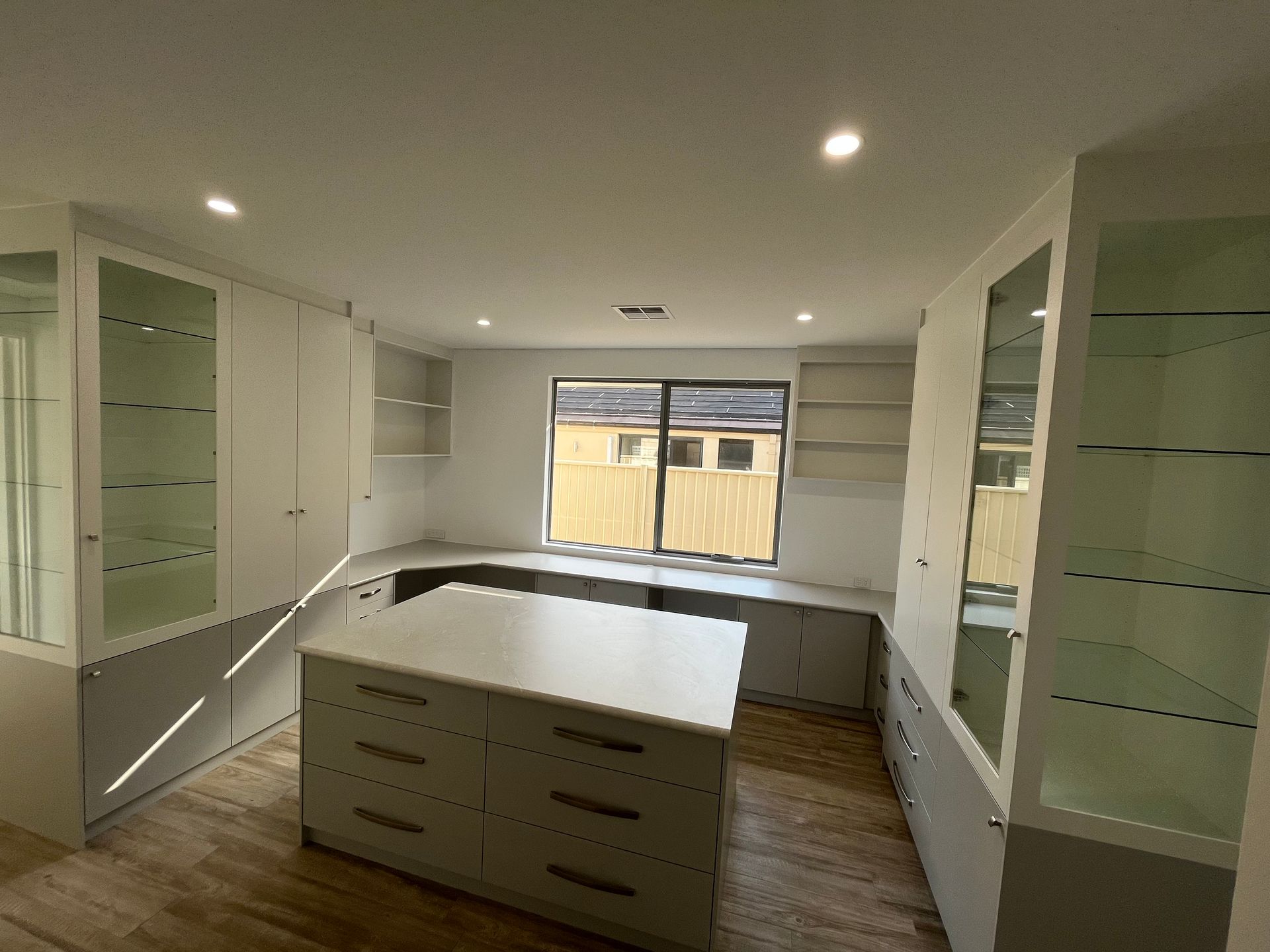 Built In Desk And Display Cupboards.