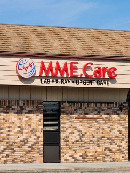 A brick building with a sign that says mme care
