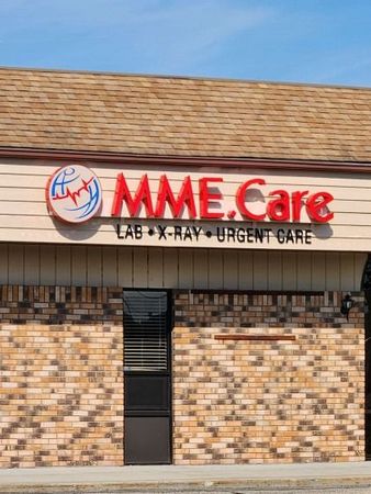 A brick building with a sign that says mme care