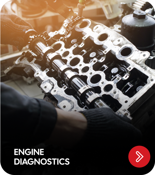 Mechanic working on a car engine; text reads 