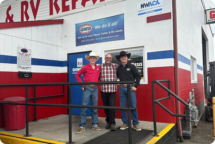 Three men in cowboy attire pose in front of a red, white, and blue RV repair shop | Genesis Automotive and RV Repair