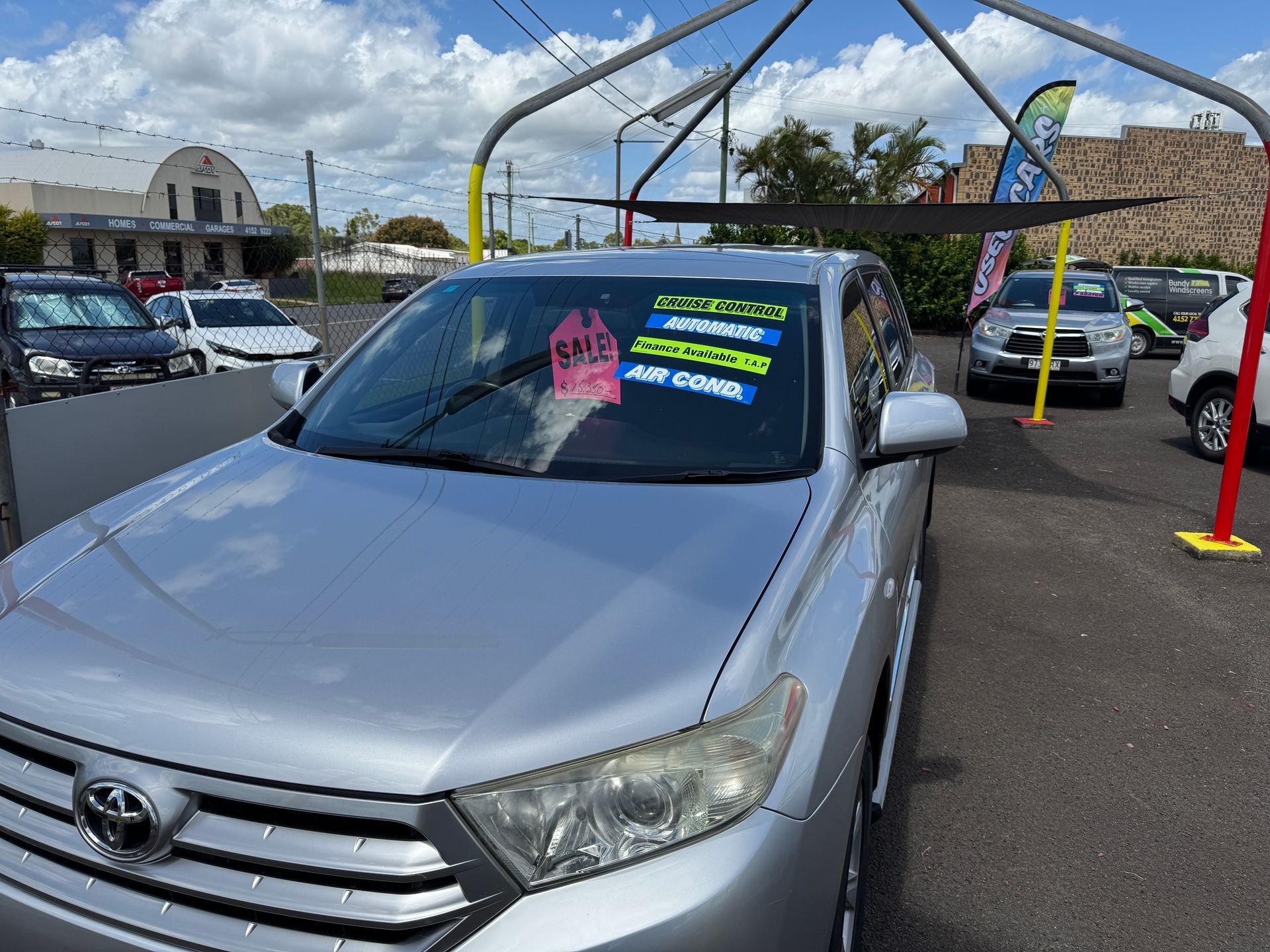 A Silver Car is For Sale in a Car Yard — N & R Automotive Group in Bundaberg East, QLD