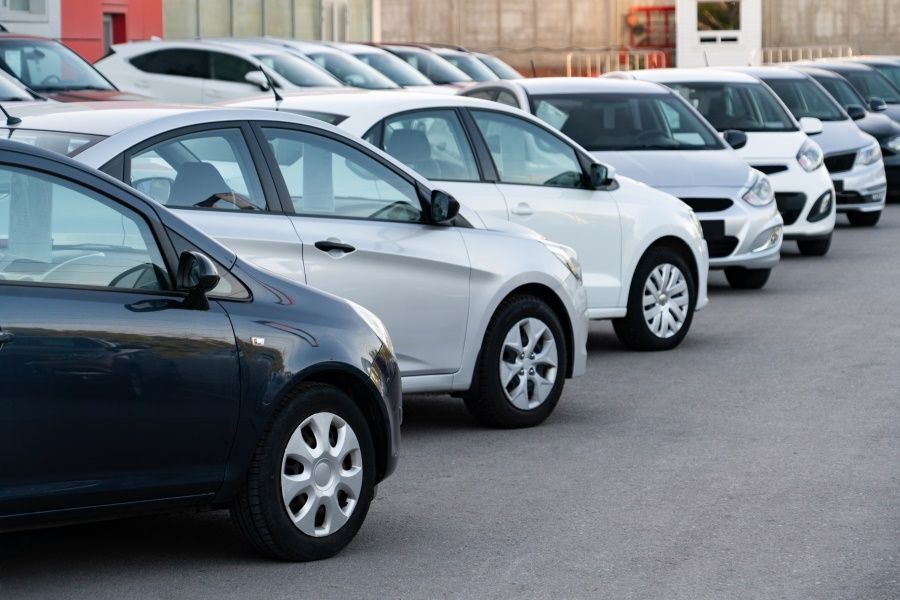 A Row of Cars Are Parked in a Parking Lot — N & R Automotive Group in  Bundaberg East, QLD