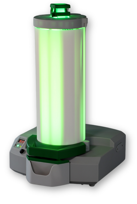 A green light is coming out of a white cylinder.