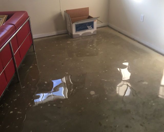 flooded and water-damaged home room