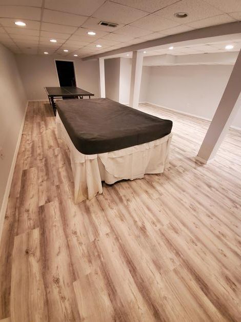 There is a pool table in the middle of the room.