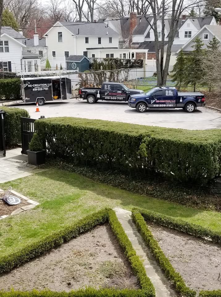 Two trucks are parked in front of a house