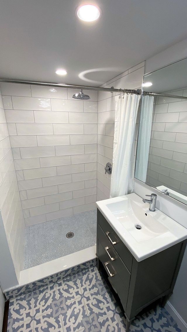 White sink with cupboard - Mendon, MA | American Bath Works