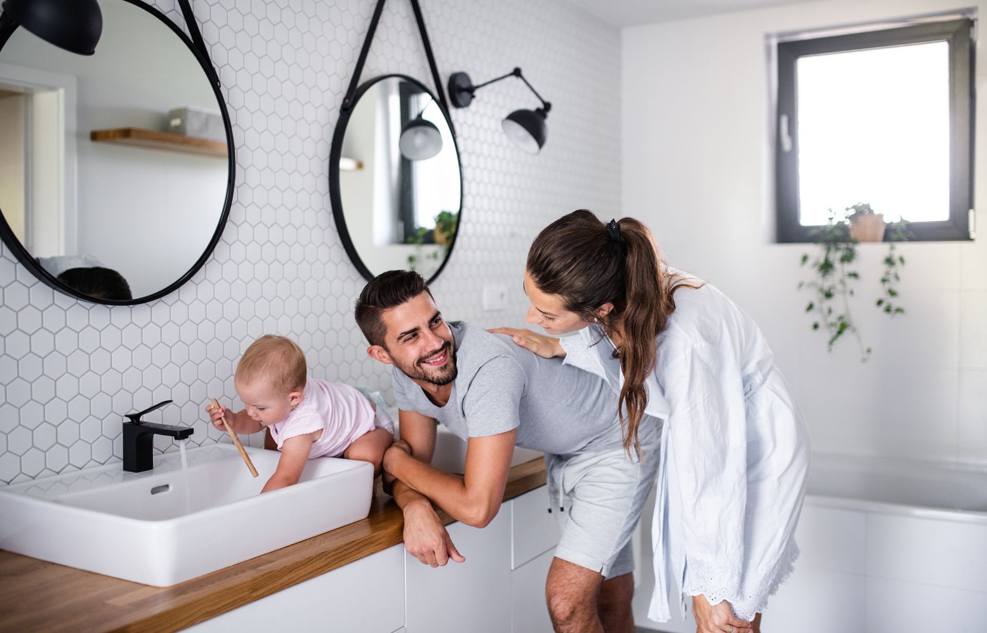 Happy family in bathroom - Mendon, MA | American Bath Works
