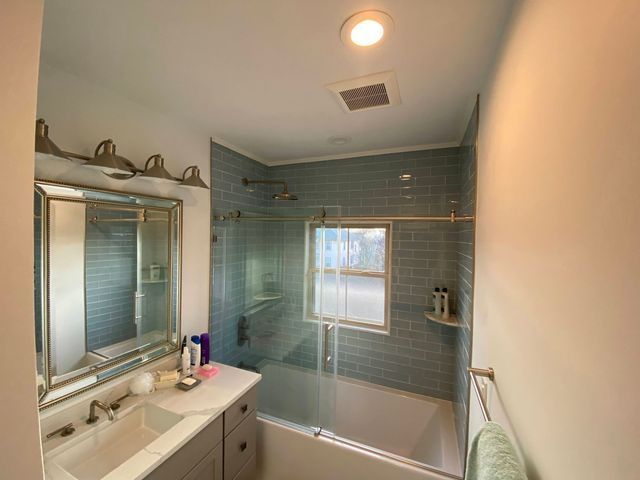 Window part of green tile bathroom - Mendon, MA | American Bath Works