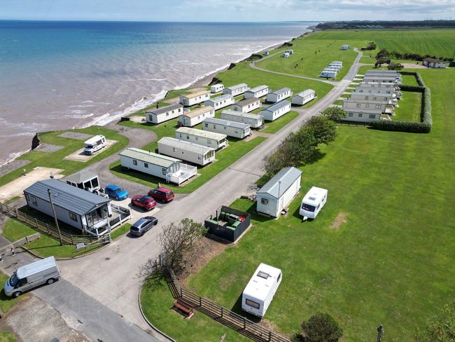 An aerial view of a holiday park in yorkshire with lodges