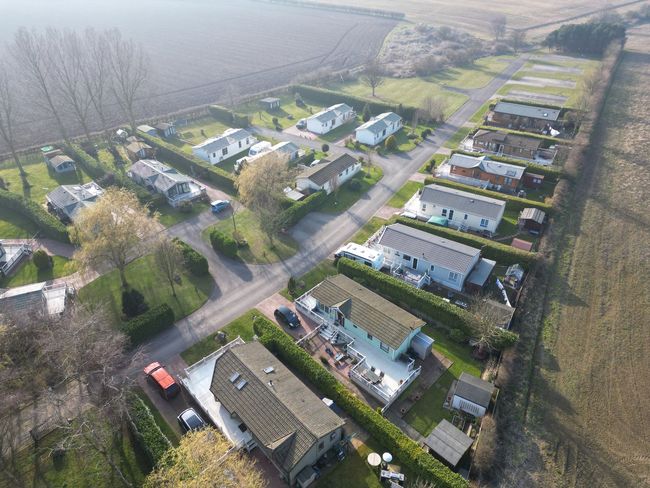An aerial view of a holiday park in yorkshire with lodges