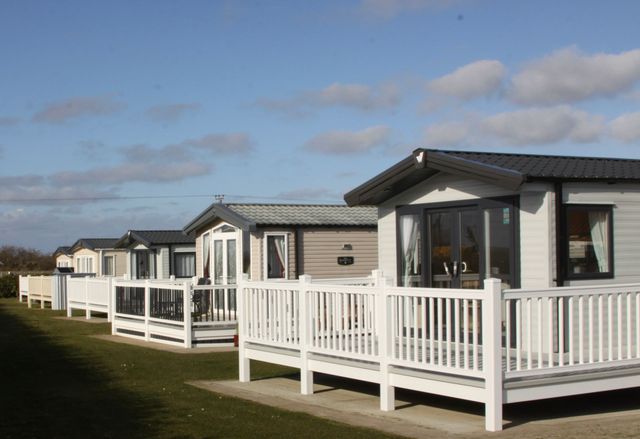 An aerial view of a holiday park in yorkshire with lodges