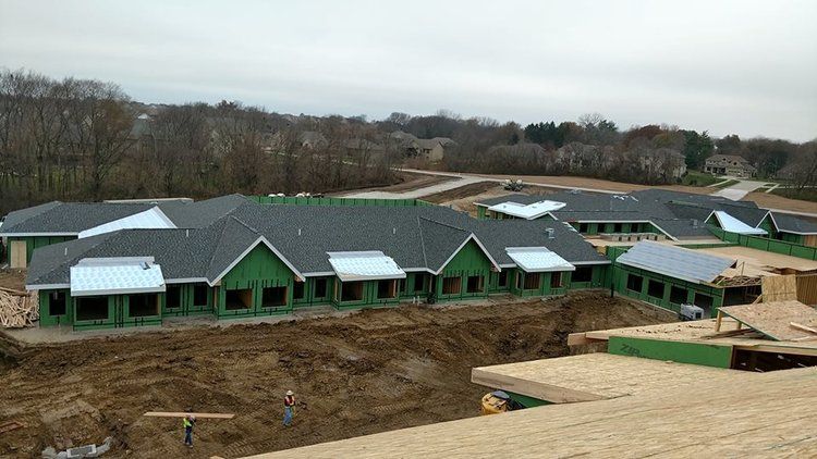 An aerial view of a large building under construction.