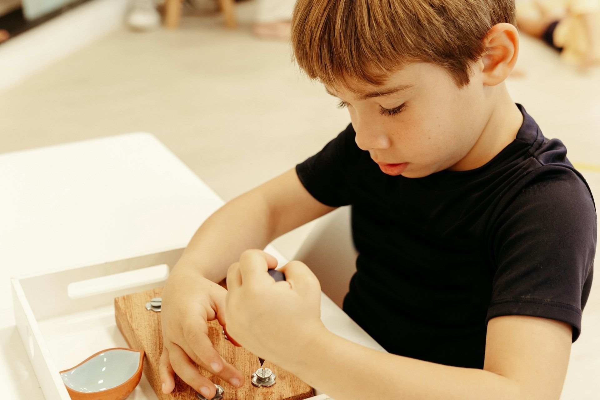 child studying montessori