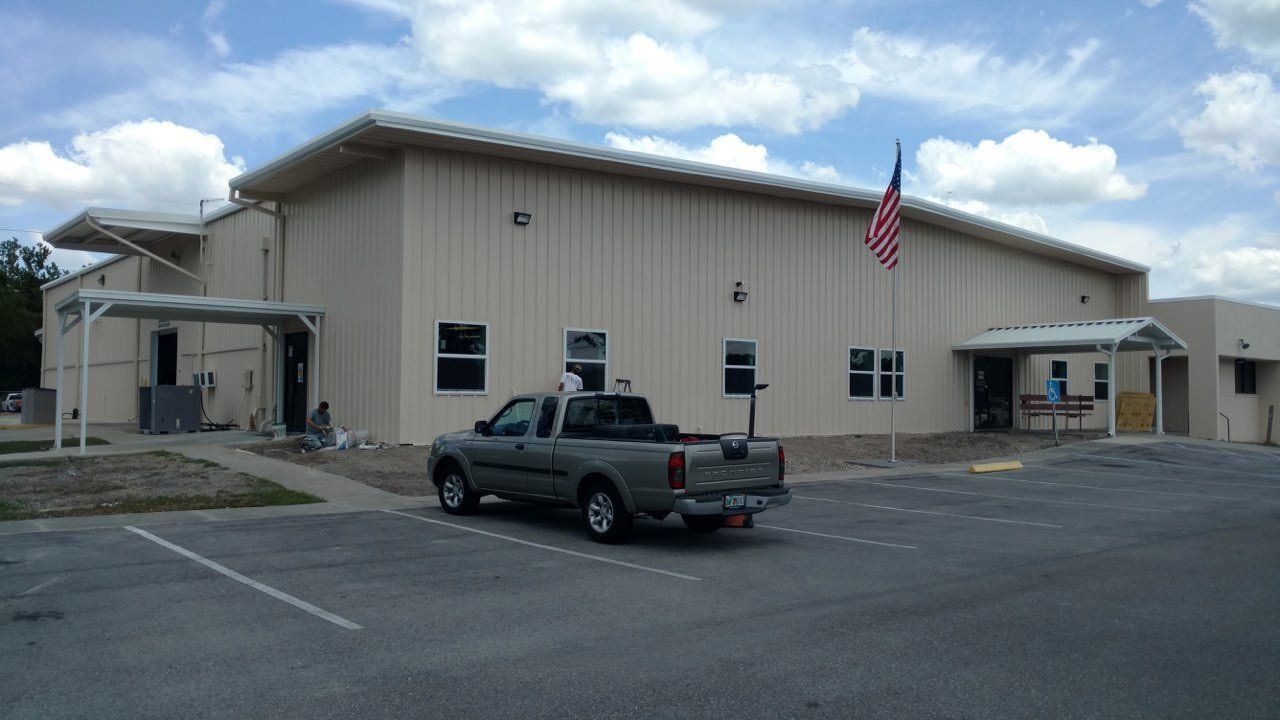 Warehouse with Car Outside — Tampa, FL — George Gsolar & Co.