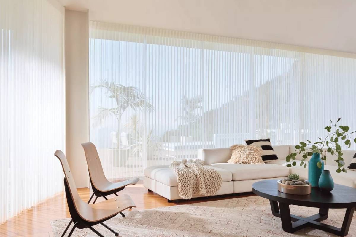 Hunter Douglas Luminette® Privacy Sheers Along Window Walls in a Modern Living Room